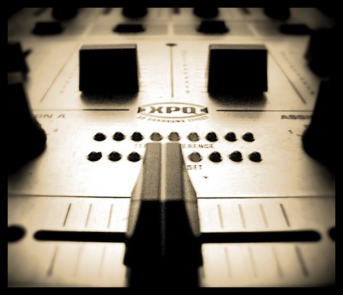 A crossfader on a DJ mixer